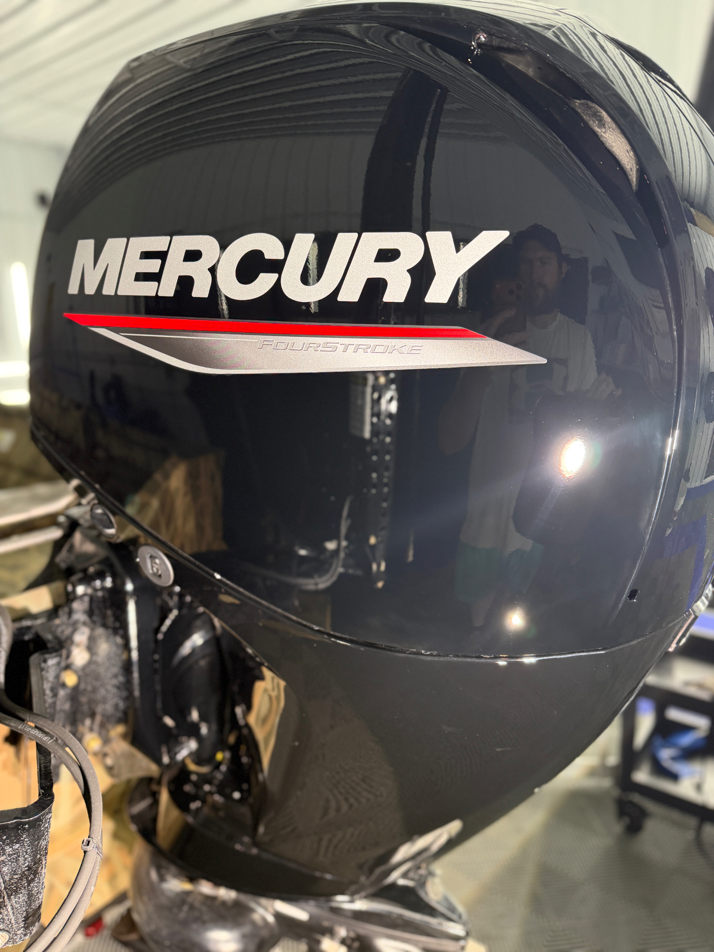 Mercury outboard motor cowling polished to a mirror finish after paint correction at Porter’s Detailing