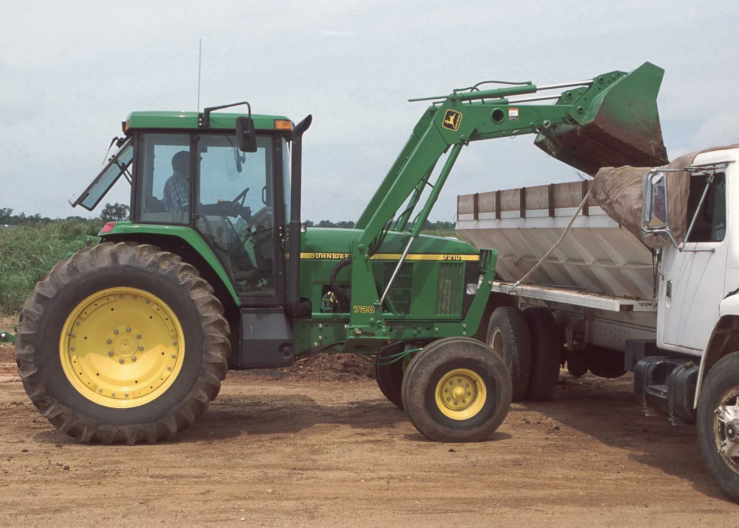 John Deere row-crop tractor with a loader