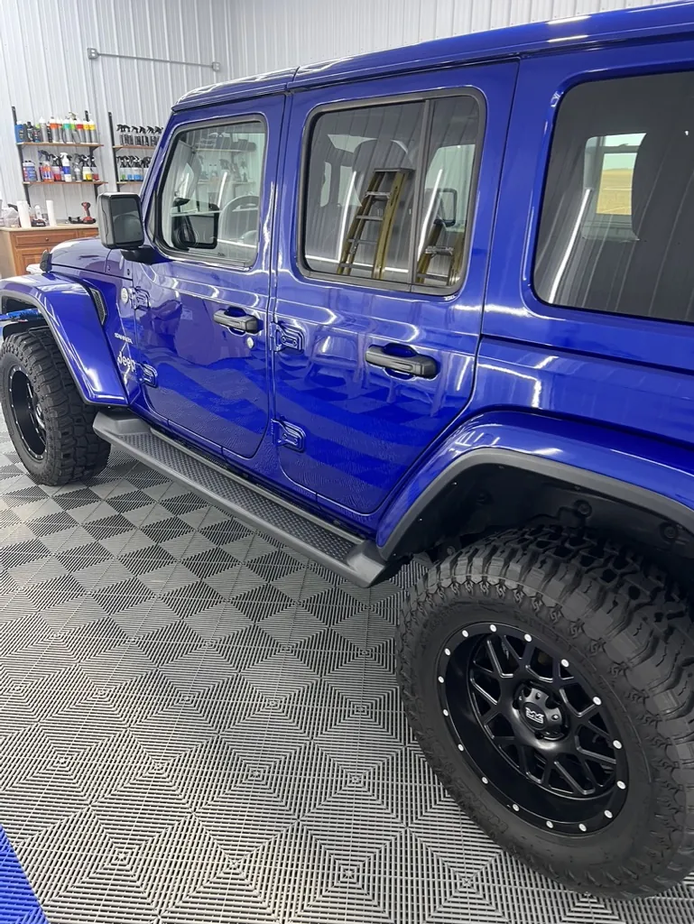 Blue Jeep front end after paint correction