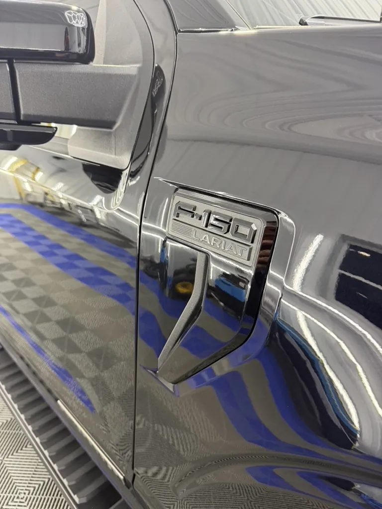 Paint panel under inspection lighting after correction