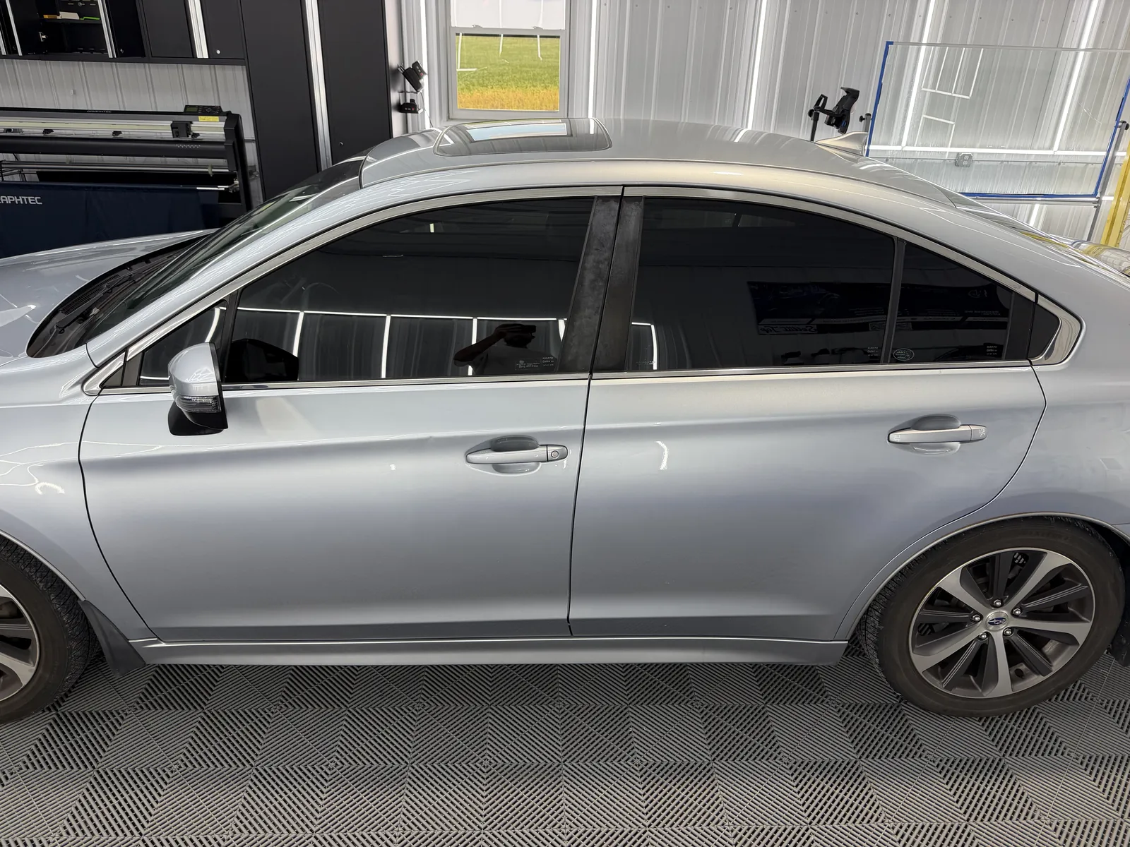Silver sedan with professionally installed window tint