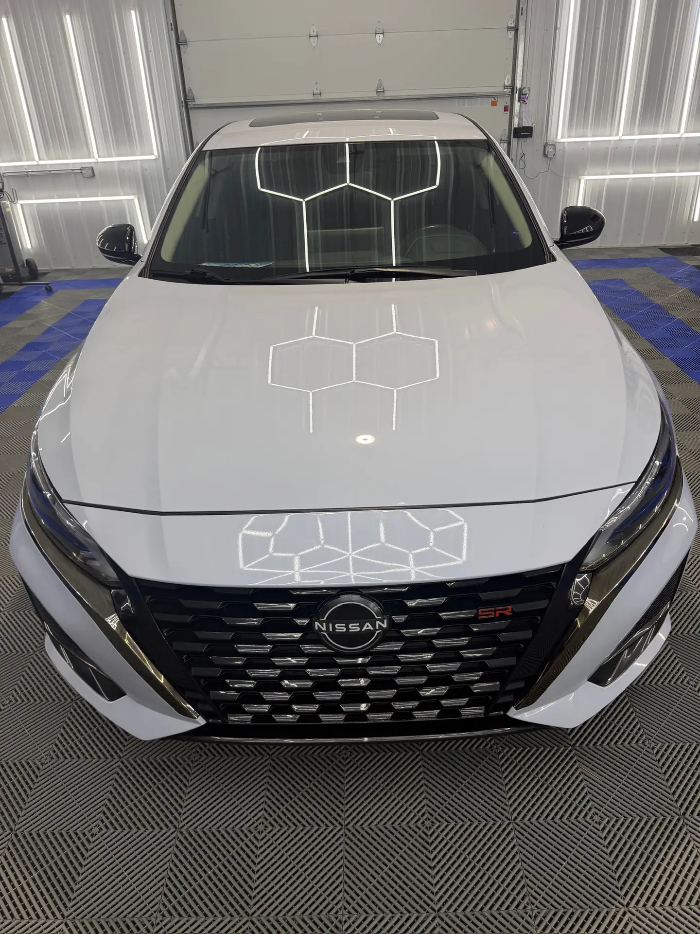 white nissan paint corrected and protected with a ceramic coating